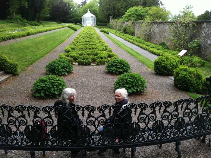 Nan and Sherrie on the wrought iron park bench